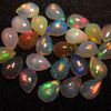 calebrated size - Ethiopian Opal - really - tope grade high quality CABOCHON - tear drops shape each pcs - have amazing - beautifull - flashy fire all around in the stone - huge size -5x7 mm approx 25 pcs -- STUNNING QUALITY - VERY VERY RARE